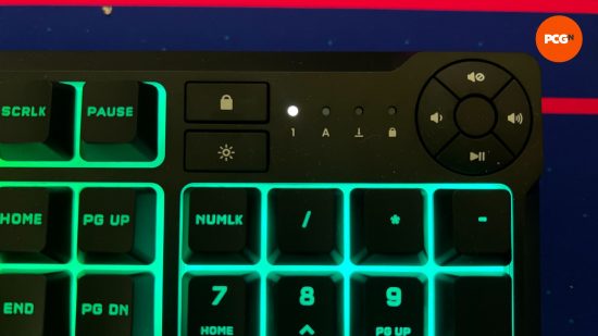 a closeup of the corsair k55 media controls