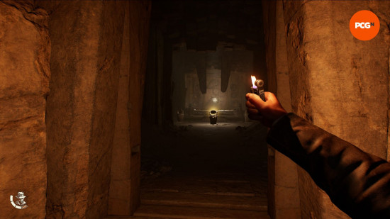 Indiana Jones and the Great Circle: review: first person view of a man holding a lighter in a dark tunnel.