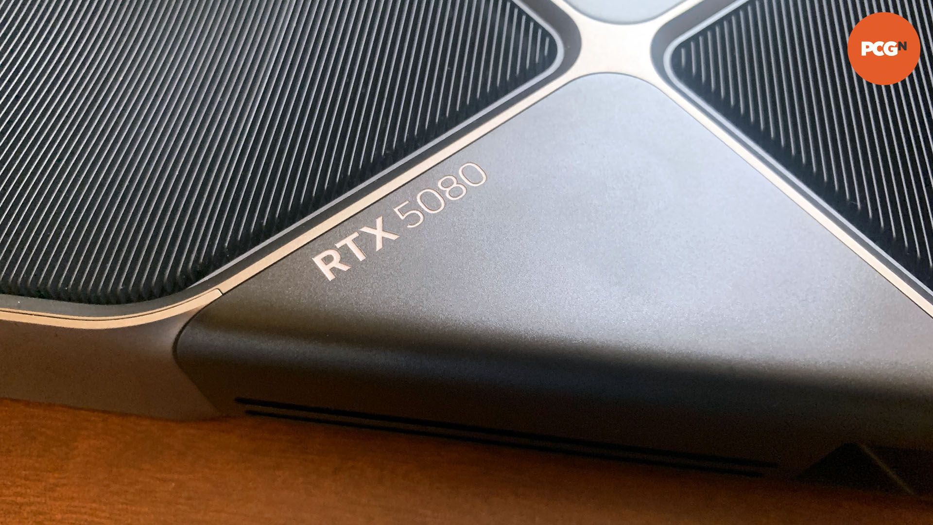 Nvidia GeForce RTX 5080 review: Closeup of text on rear of Founders Edition graphics card.